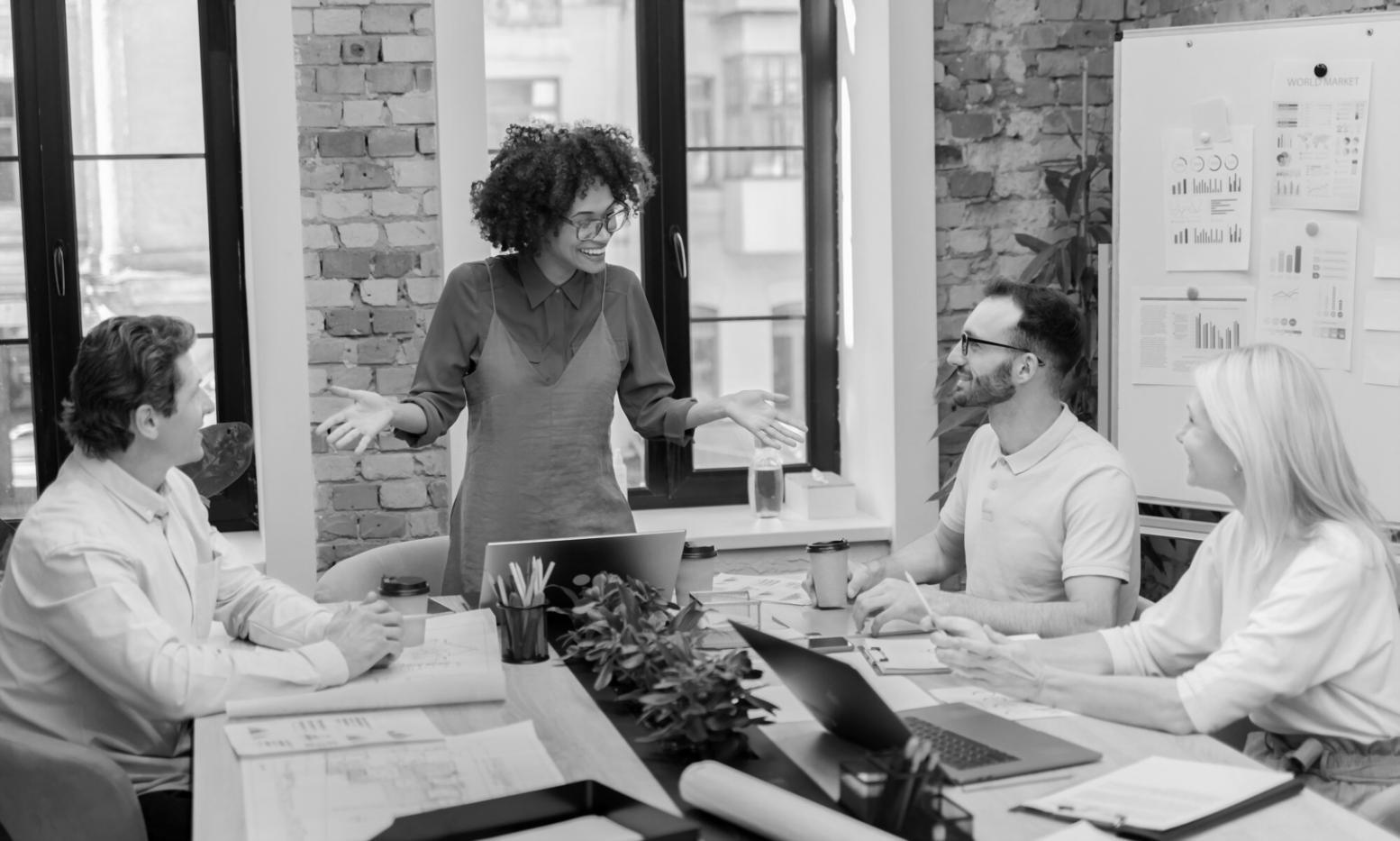 Finance professional reviewing complex multi-year projection model with stakeholders